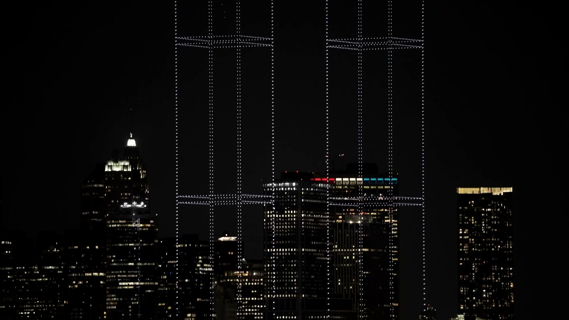 Film of 2,977 lights rising over New York Harbor and forming the Twin Towers